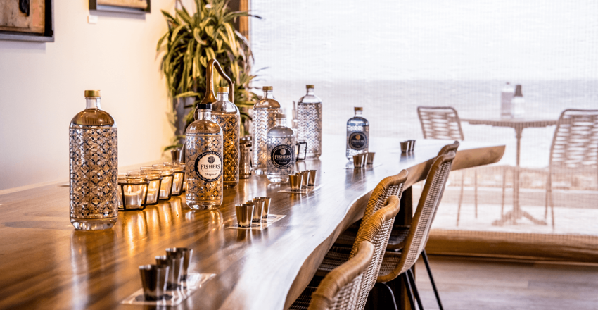 Inside Fishers Distillery, table with selection of gins displayed