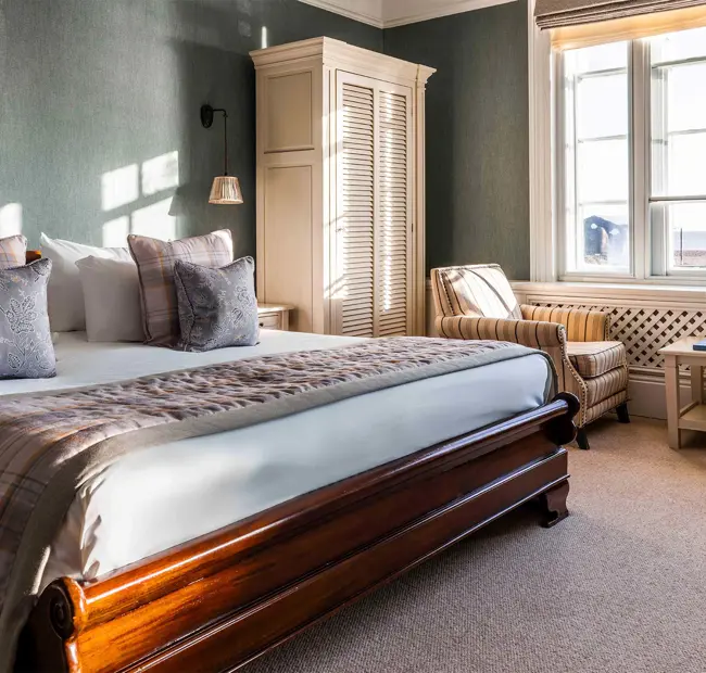 The White Lion bedroom showing bed and seating area