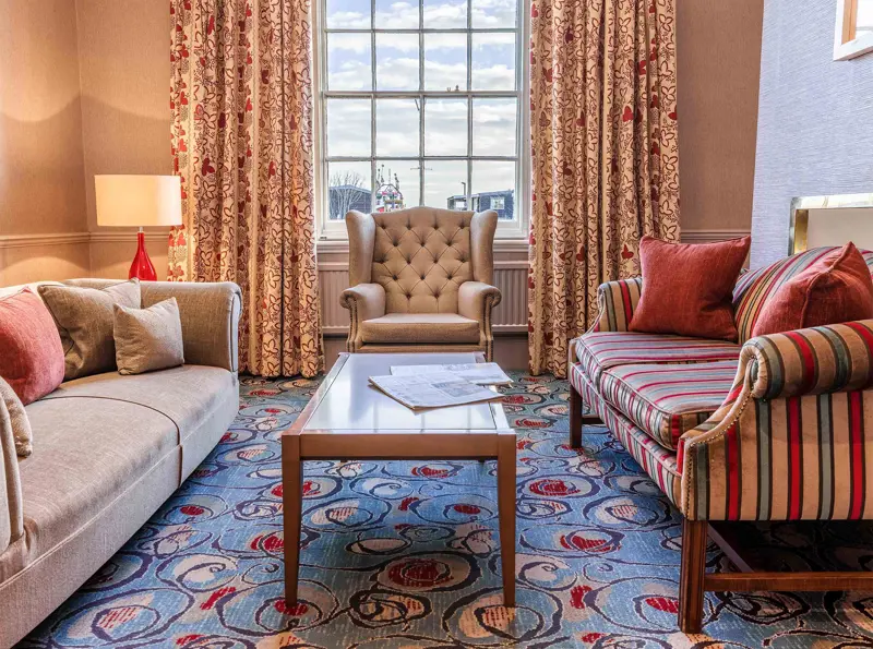 White Lion Hotel: Coastal Hotel in Aldeburgh, Suffolk, lounge with chair feature 