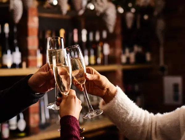 Toasting champagne at the bar