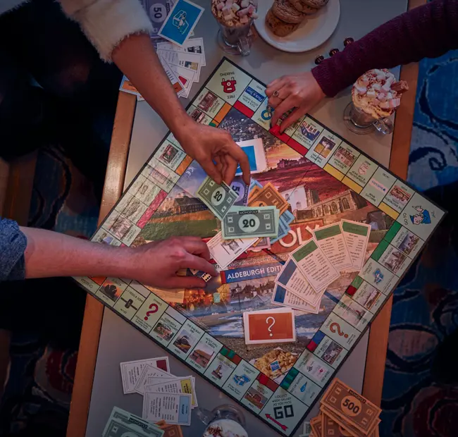 The White Lion, guests playing monopoly board game